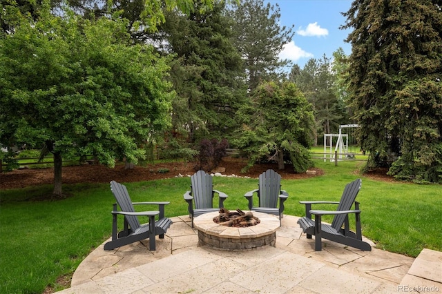 5340 S Logan Dr, Greenwood Village, CO 80121 - view of patio with an outdoor fire pit and view of scattered trees
