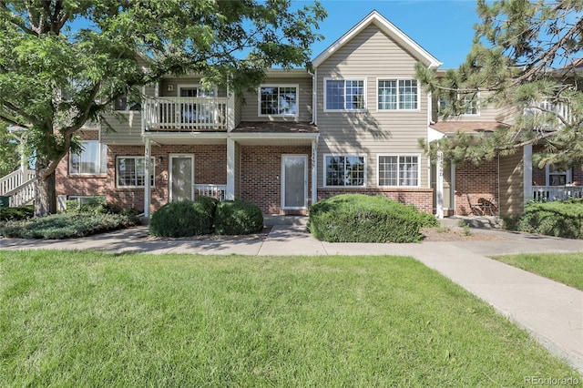 14496 E Tufts Pl Unit C, Aurora, CO 80015 - multi unit property featuring brick siding, a front lawn, and a balcony