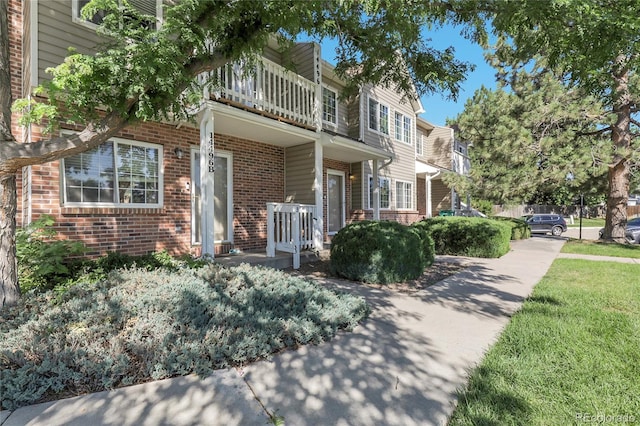 14496 E Tufts Pl Unit C, Aurora, CO 80015 - multi unit property featuring a balcony, brick siding, and a porch
