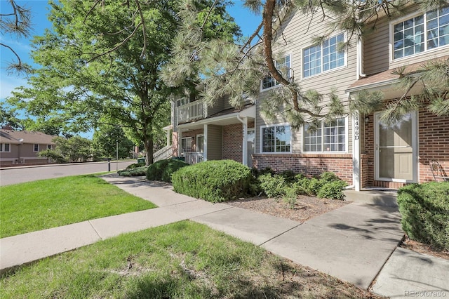 14496 E Tufts Pl Unit C, Aurora, CO 80015 - view of front of property with brick siding and a front yard