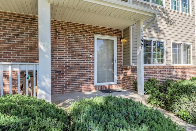14496 E Tufts Pl Unit C, Aurora, CO 80015 - property entrance featuring brick siding