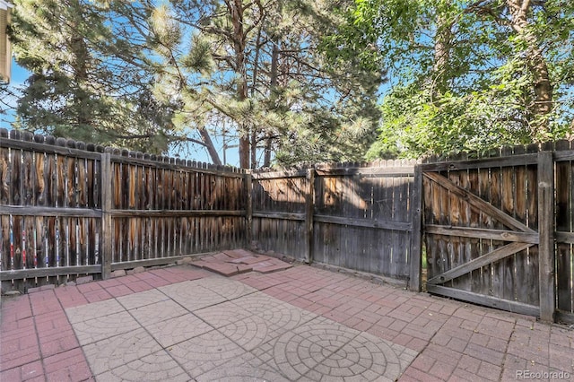 14496 E Tufts Pl Unit C, Aurora, CO 80015 - fenced backyard with a patio area