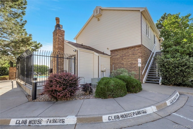 14496 E Tufts Pl Unit C, Aurora, CO 80015 - view of home's exterior with brick siding and stairway