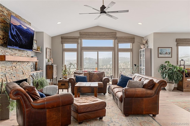 505 Rd P69, Bailey, CO 80421 - living room featuring light wood-style floors, ceiling fan, vaulted ceiling, and a fireplace