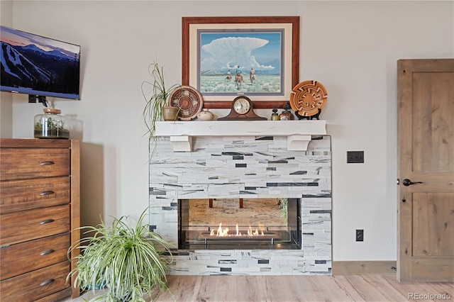 505 Rd P69, Bailey, CO 80421 - interior details featuring a multi sided fireplace and wood finished floors