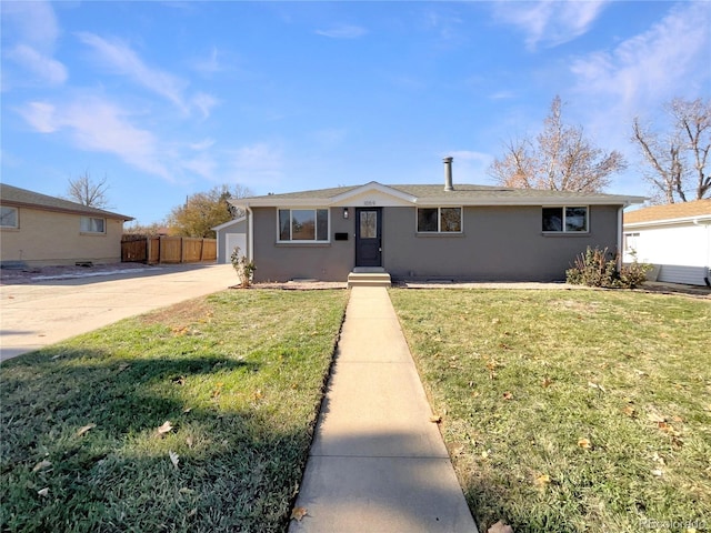 view of front of house with a garage and a front yard