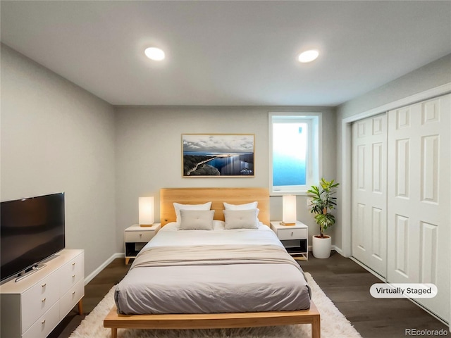 bedroom featuring a closet and dark hardwood / wood-style floors