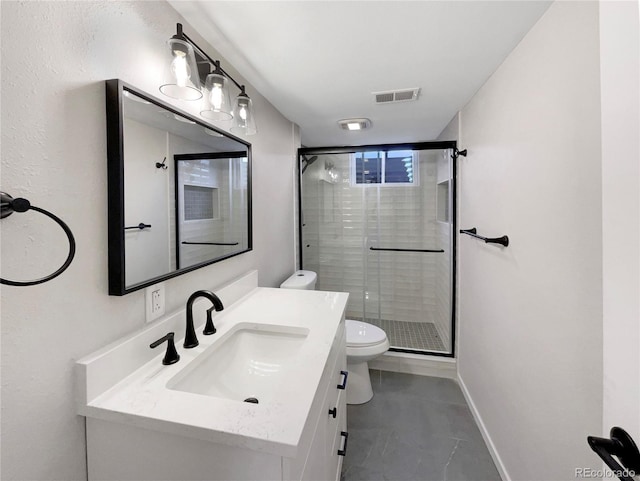 bathroom featuring vanity, toilet, and an enclosed shower