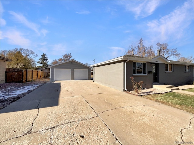 ranch-style house with an outbuilding and a garage