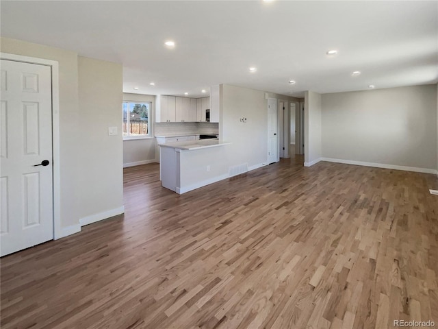 unfurnished living room with light hardwood / wood-style floors