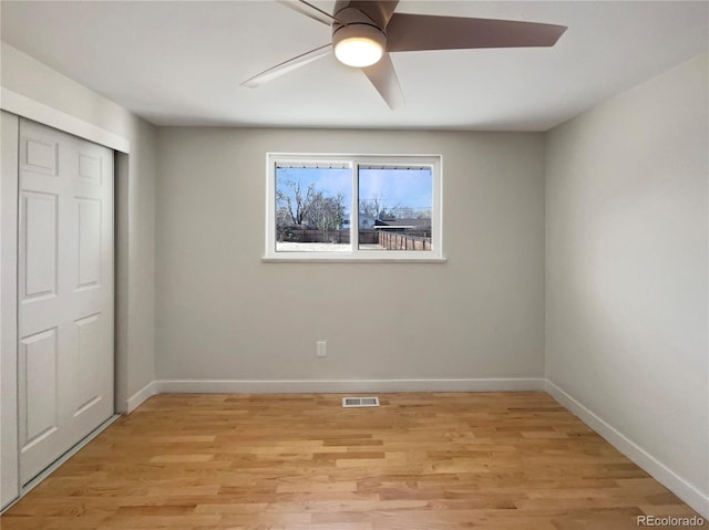 unfurnished bedroom with a closet, ceiling fan, and light hardwood / wood-style flooring