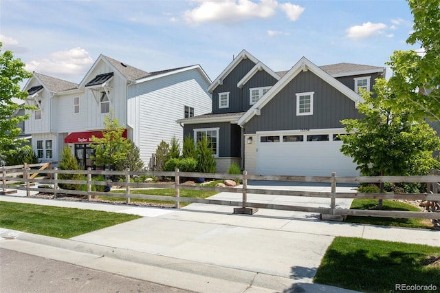 13334 Blue Amber Ct, Parker, CO 80134 - view of front facade with board and batten siding, driveway, and a fenced front yard