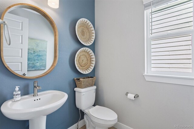 13334 Blue Amber Ct, Parker, CO 80134 - bathroom featuring baseboards and a sink