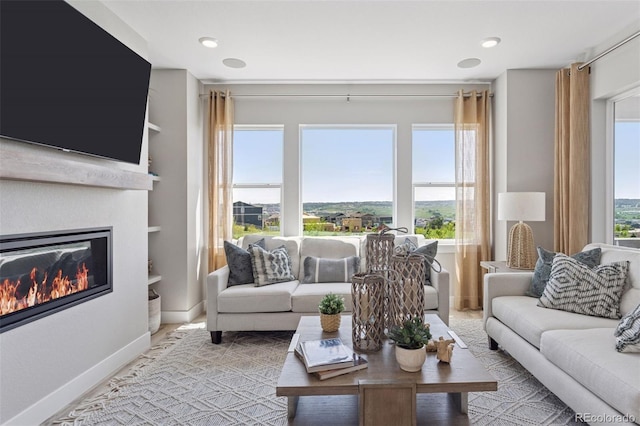 13334 Blue Amber Ct, Parker, CO 80134 - living room with a glass covered fireplace and recessed lighting