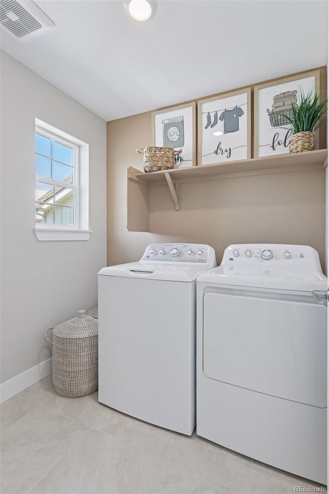 13334 Blue Amber Ct, Parker, CO 80134 - laundry room featuring separate washer and dryer and light tile patterned floors