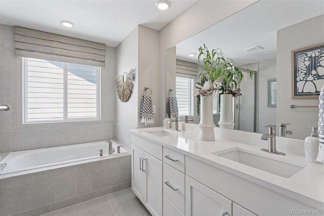 13334 Blue Amber Ct, Parker, CO 80134 - bathroom with a bath, double vanity, tile patterned floors, and a shower with door