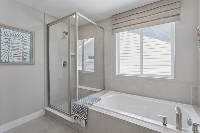 13334 Blue Amber Ct, Parker, CO 80134 - full bath featuring a bath, a shower stall, and tile patterned floors