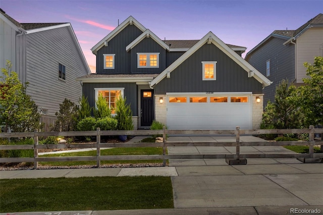 13334 Blue Amber Ct, Parker, CO 80134 - view of front facade featuring board and batten siding, driveway, and an attached garage