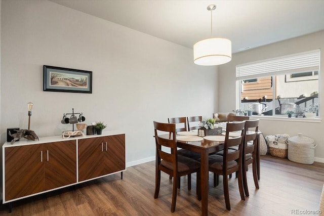 dining space featuring dark hardwood / wood-style flooring