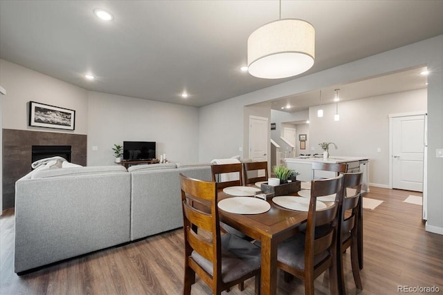 dining space featuring dark hardwood / wood-style flooring and sink