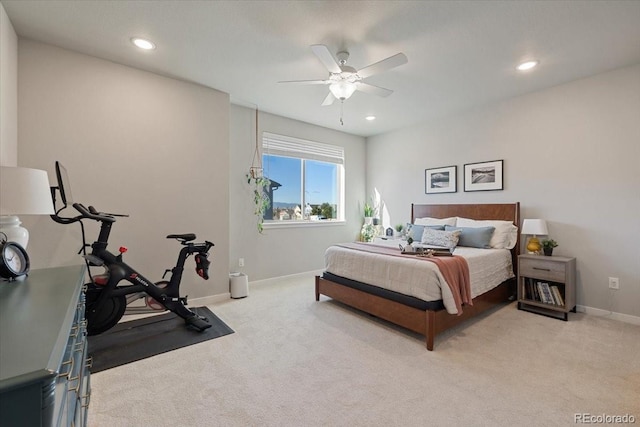 bedroom featuring light carpet and ceiling fan