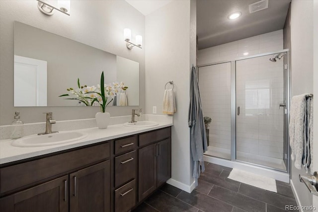 bathroom featuring vanity and a shower with shower door