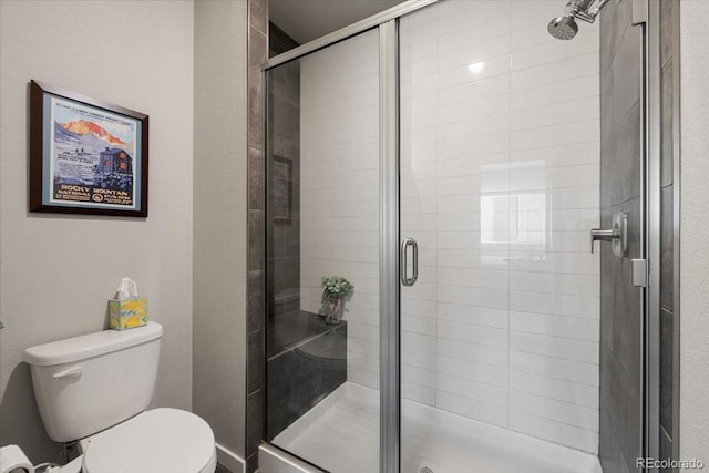 bathroom with toilet and walk in shower