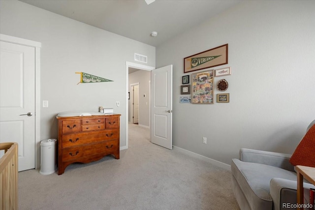 living area with light carpet