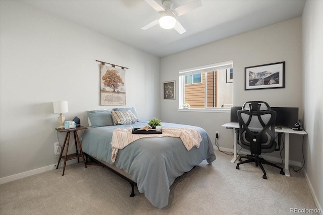 bedroom with ceiling fan and light colored carpet