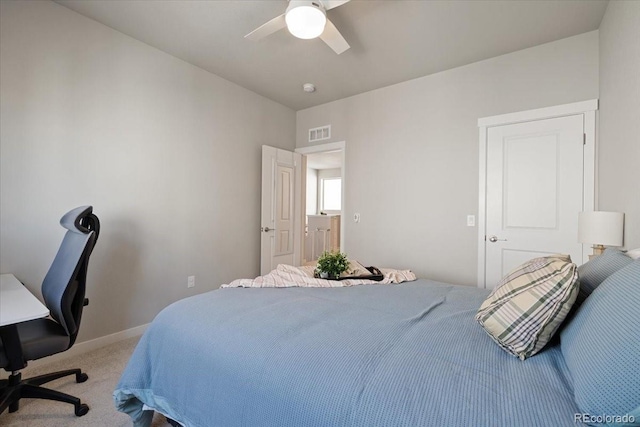 bedroom featuring ceiling fan and light carpet