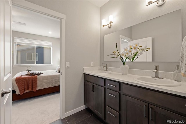 bathroom with tile patterned flooring and vanity