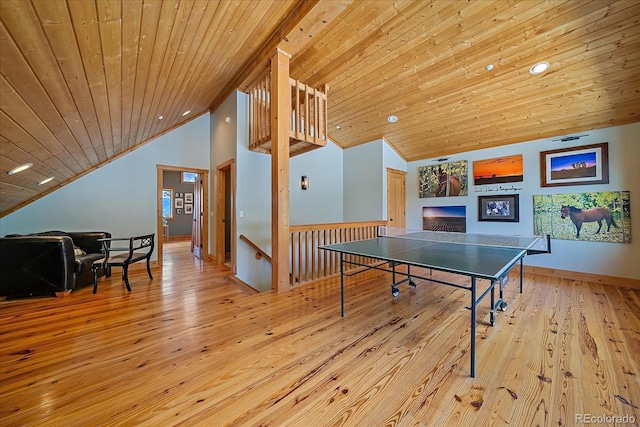 playroom with a fireplace, light hardwood / wood-style flooring, high vaulted ceiling, and wood ceiling