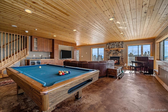 game room with wine cooler, wood ceiling, a fireplace, pool table, and indoor wet bar