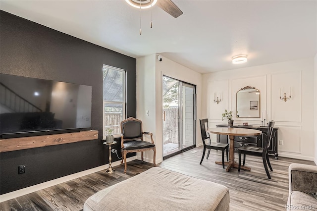 dining space featuring ceiling fan and wood-type flooring