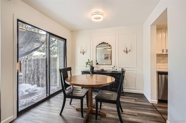 dining area featuring wood-type flooring