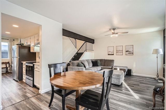 dining room featuring dark wood-type flooring and ceiling fan