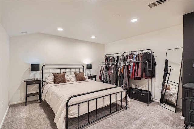 bedroom with light colored carpet