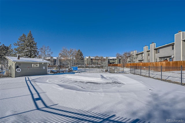 view of yard layered in snow