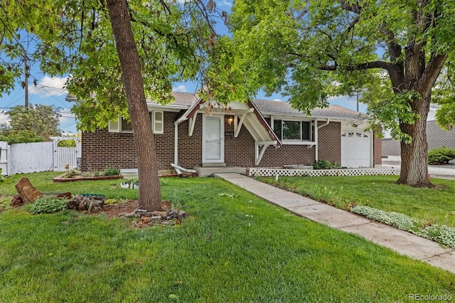 8137 Vanguard Dr, Denver, CO 80221 - view of front of property with an attached garage, brick siding, and driveway