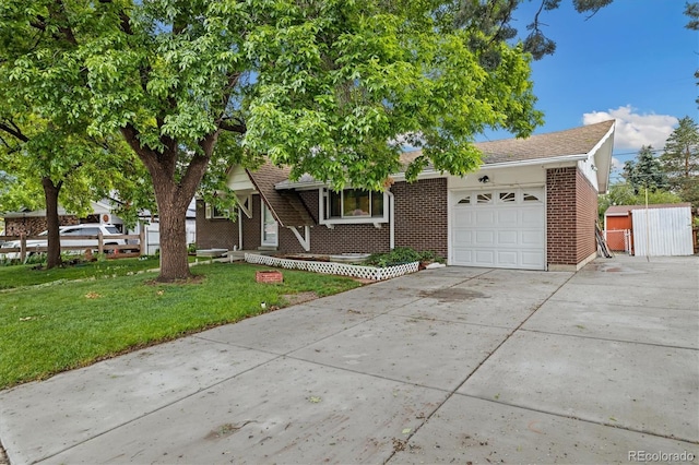 8137 Vanguard Dr, Denver, CO 80221 - view of front facade featuring an attached garage, concrete driveway, brick siding, a front yard, and a storage shed