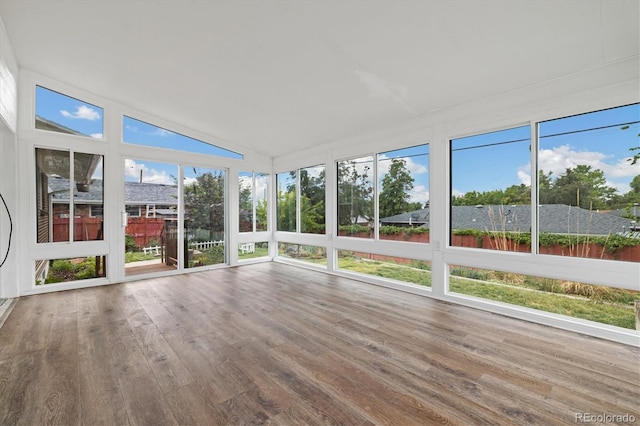 8137 Vanguard Dr, Denver, CO 80221 - unfurnished sunroom featuring wood finished floors and vaulted ceiling