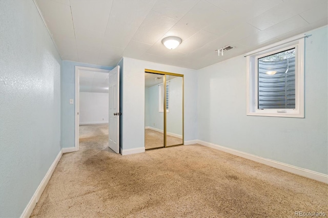 8137 Vanguard Dr, Denver, CO 80221 - unfurnished bedroom featuring carpet flooring, a closet, and baseboards