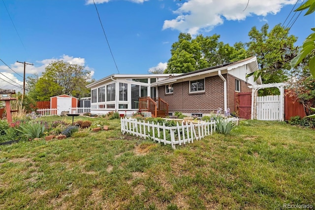 8137 Vanguard Dr, Denver, CO 80221 - rear view of house with a sunroom and brick siding