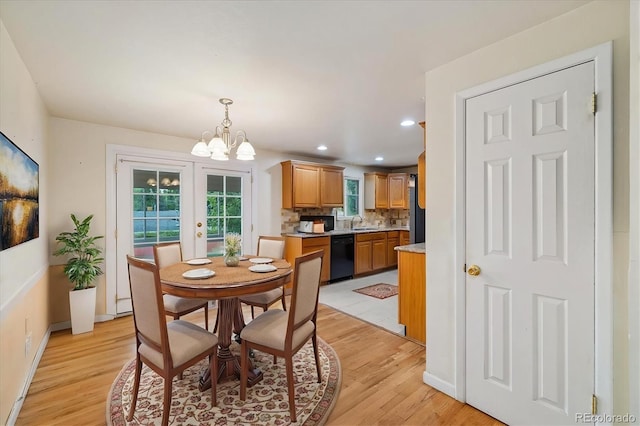 8137 Vanguard Dr, Denver, CO 80221 - dining area featuring a chandelier, light wood-style flooring, recessed lighting, and baseboards