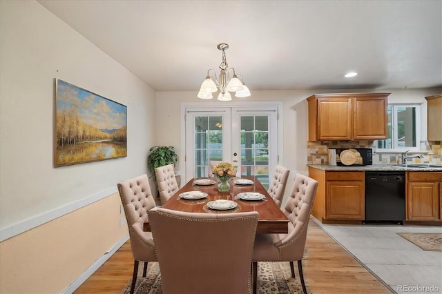 8137 Vanguard Dr, Denver, CO 80221 - dining room with a chandelier, plenty of natural light, light wood-type flooring, and recessed lighting