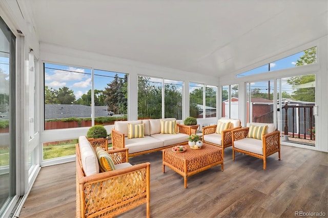 8137 Vanguard Dr, Denver, CO 80221 - sunroom / solarium featuring an outdoor living space, wood finished floors, plenty of natural light, and vaulted ceiling