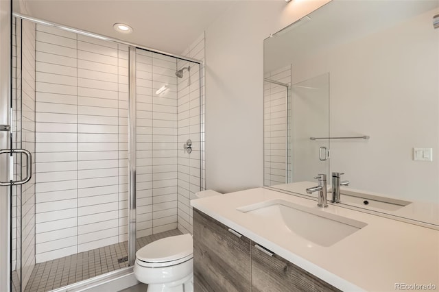 full bath with toilet, a shower stall, and vanity