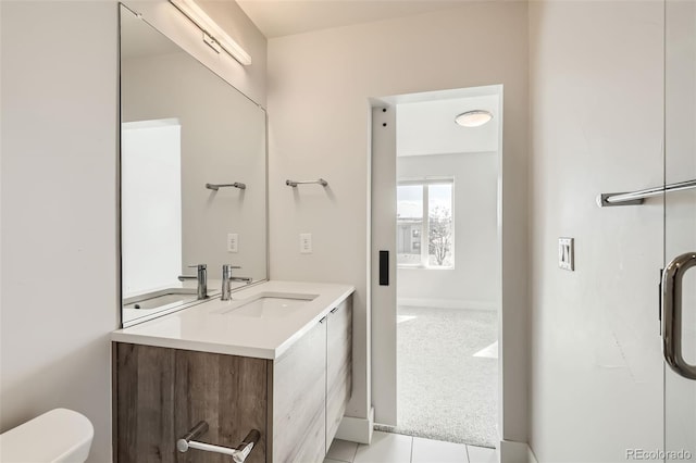 bathroom with toilet and vanity