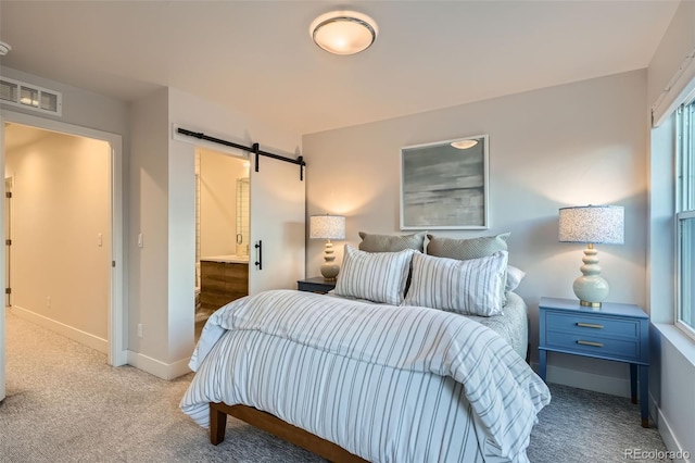 1810 Irving St Unit 4, Denver, CO 80204 - carpeted bedroom featuring a barn door, baseboards, and visible vents