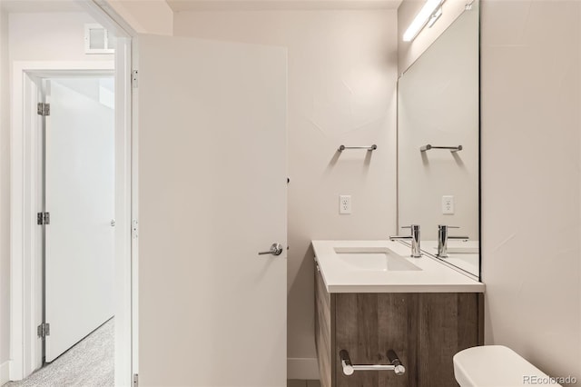 1810 Irving St Unit 4, Denver, CO 80204 - half bathroom with toilet, baseboards, vanity, and visible vents